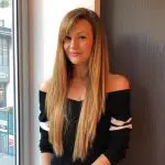 Photo of Eszter from the team stood by office window