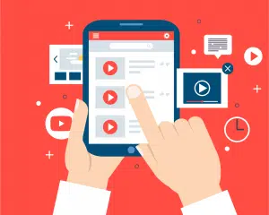 Hand of person on tablet with YouTube open on red background